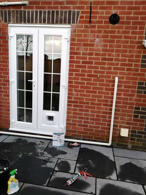 Cat flap installations through a wall
