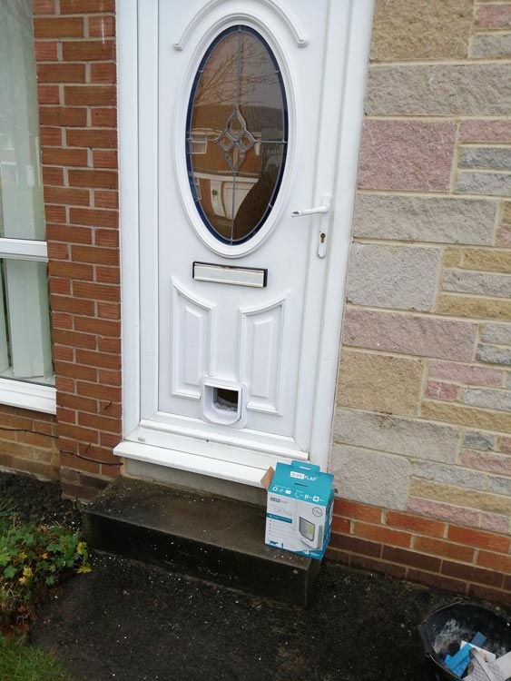 Cat flap installations through a brick wall