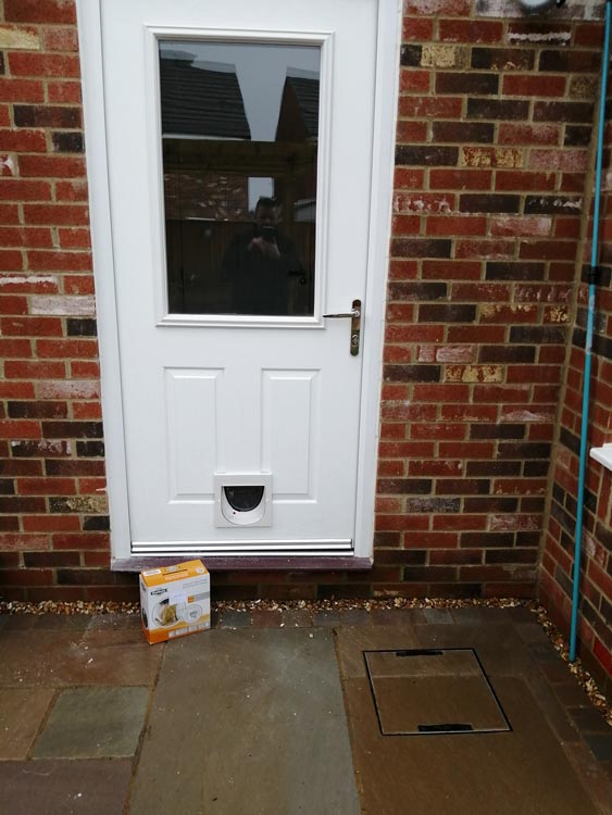 Cat flap installations through a brick wall