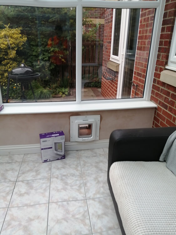 Cat flap tunnels fitted through the wall