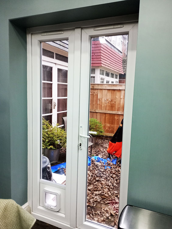 Cat flaps installed in glass doors High Heaton