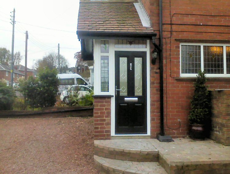 kommerling porch with a black Solidor composite door Gateshead
