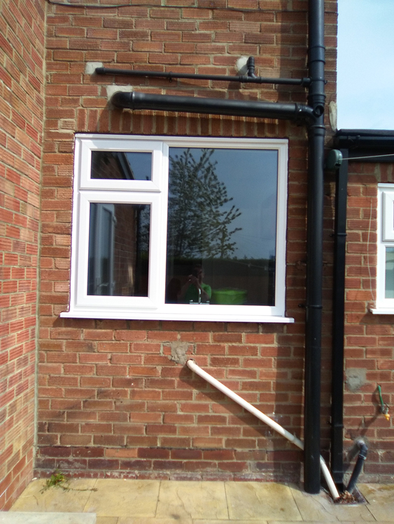 Rehau PVCu replacement window and door fitted with 36mm triple glazing in Throckley 36mm and 44mm replacement triple glazed Rehau windows Newcastle